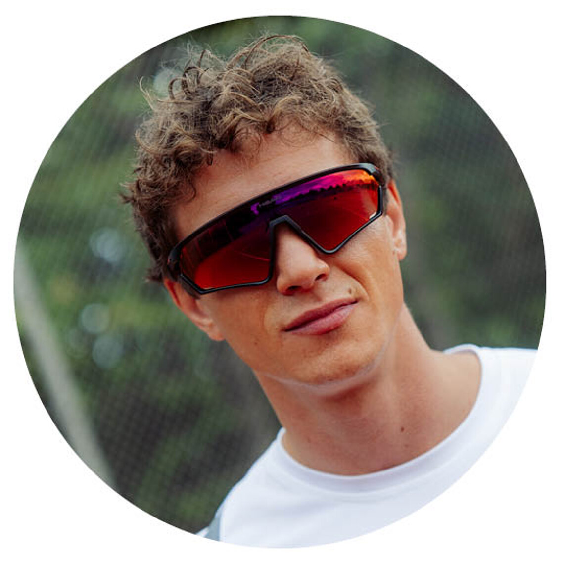 Man wearing red HEAD shield sunglasses.