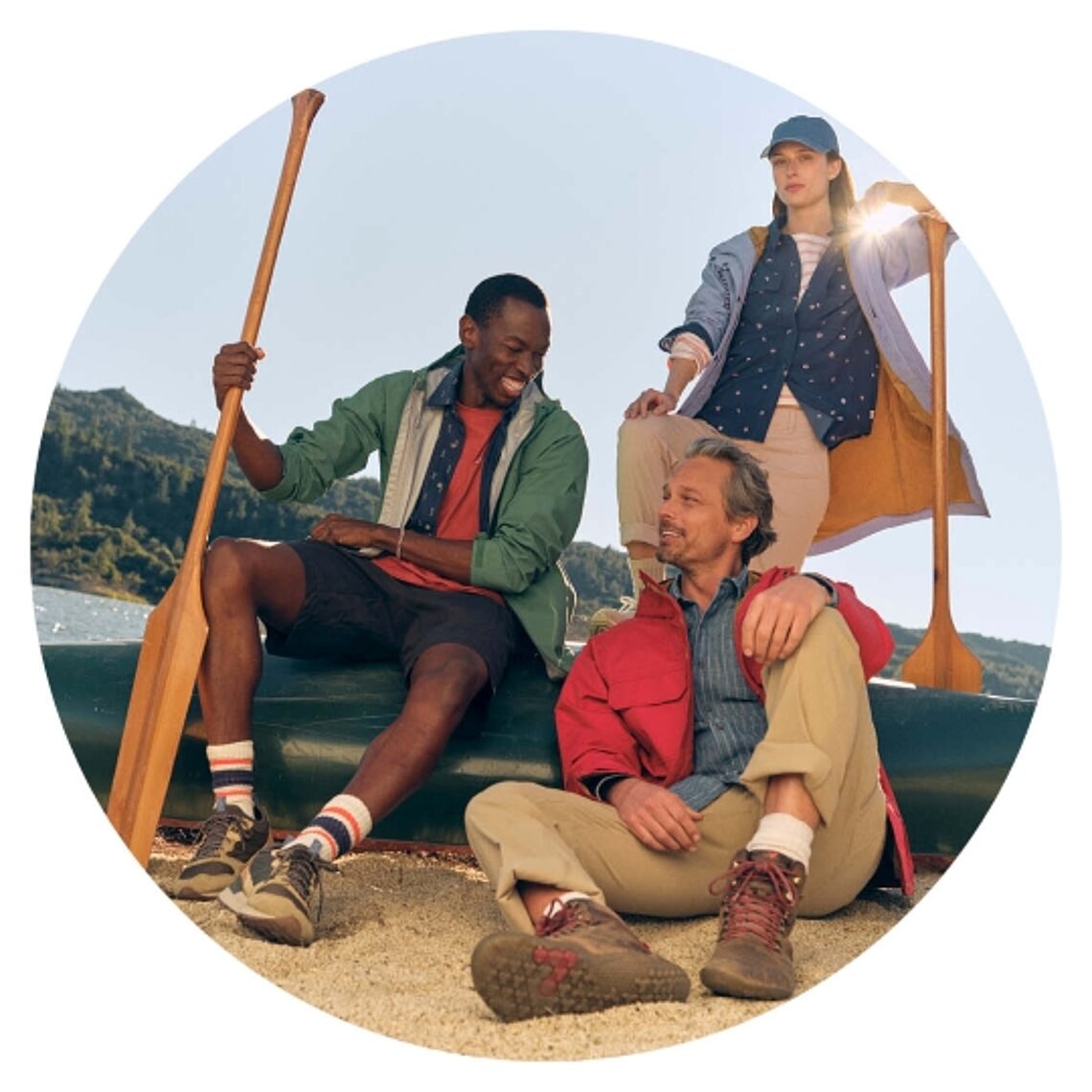 Group wearing Eddie Bauer during outdoor adventure by the water